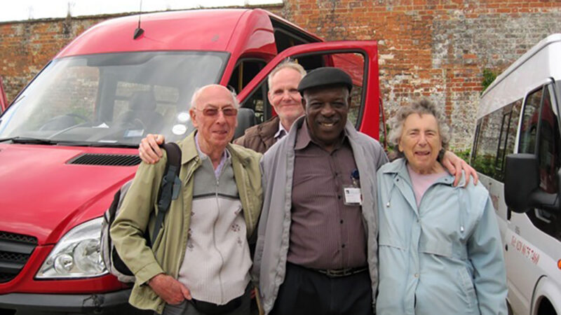 Volunteers in front of bus